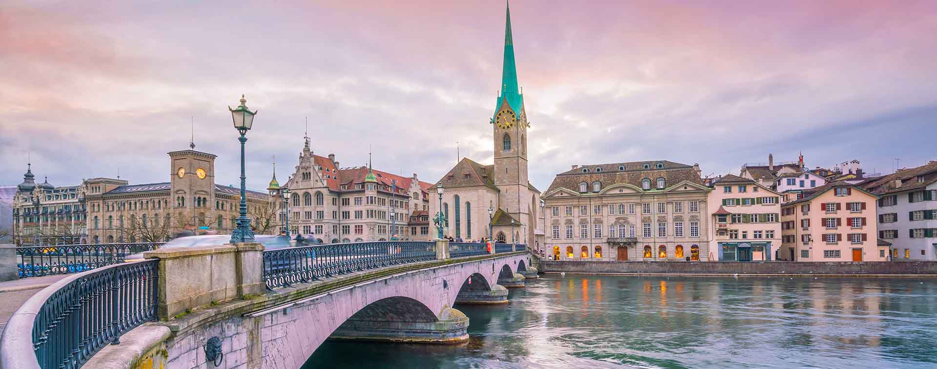The historic center of Zurich, Switzerland, featuring the Limmat River and the iconic Fraumünster Church