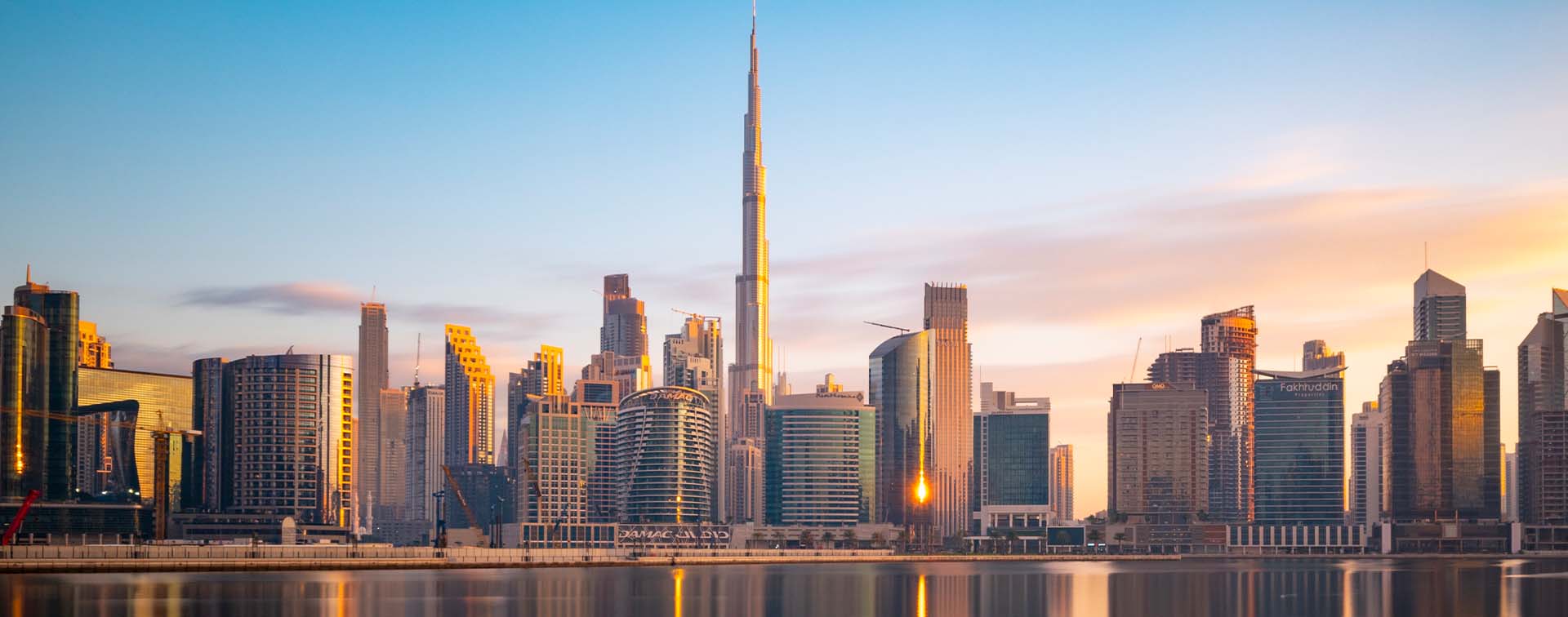 Long exposure of The Business Bay Dubai city skyline at twilight, UAE