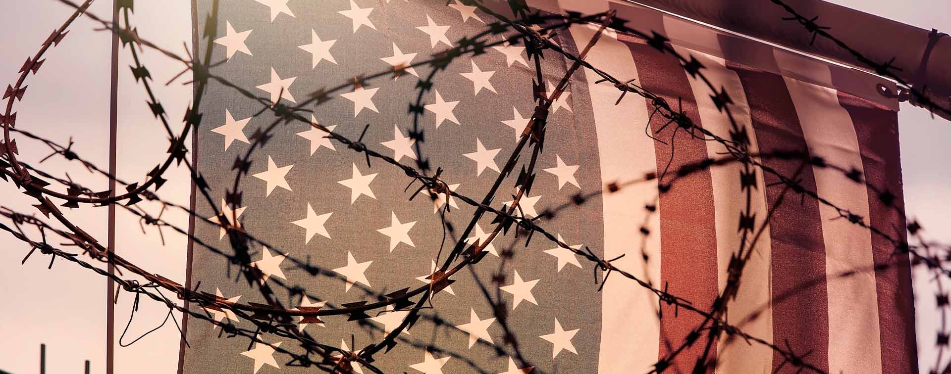 American flag and barbed wire, USA border