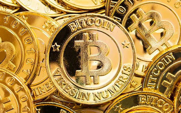 Bitcoin cryptocurrency background. Golden bitcoin, digital currency