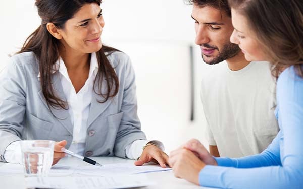 A couple consulting an advisor