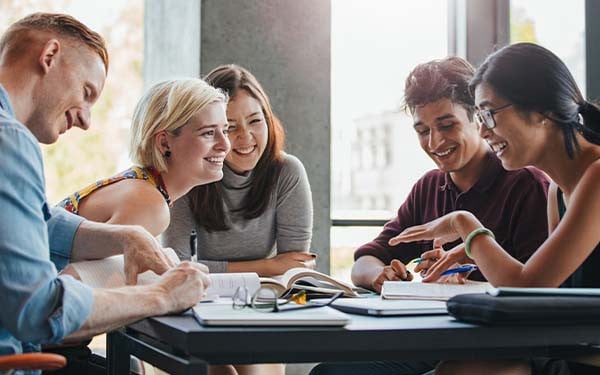 University students studying together around a table