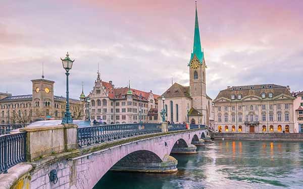 The historic center of Zurich, Switzerland, featuring the Limmat River and the iconic Fraumünster Church