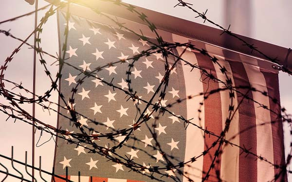 American flag and barbed wire, USA border