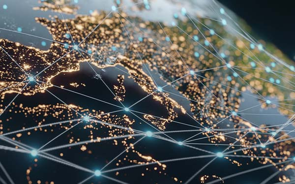 Planet earth at night with glowing connecting lines drawn over it