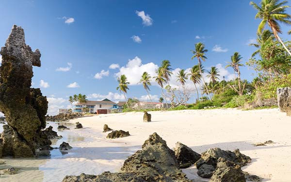 Nauru coast with beach house and rocky beach
