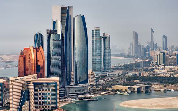 Helicopter point of view of Abu Dhabi skyline with surrounding area