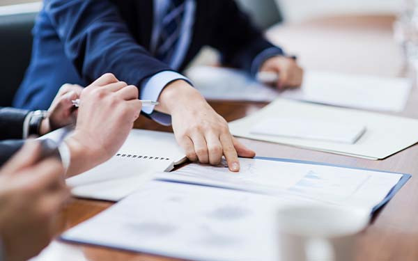 Three businessmen meeting in a conference room