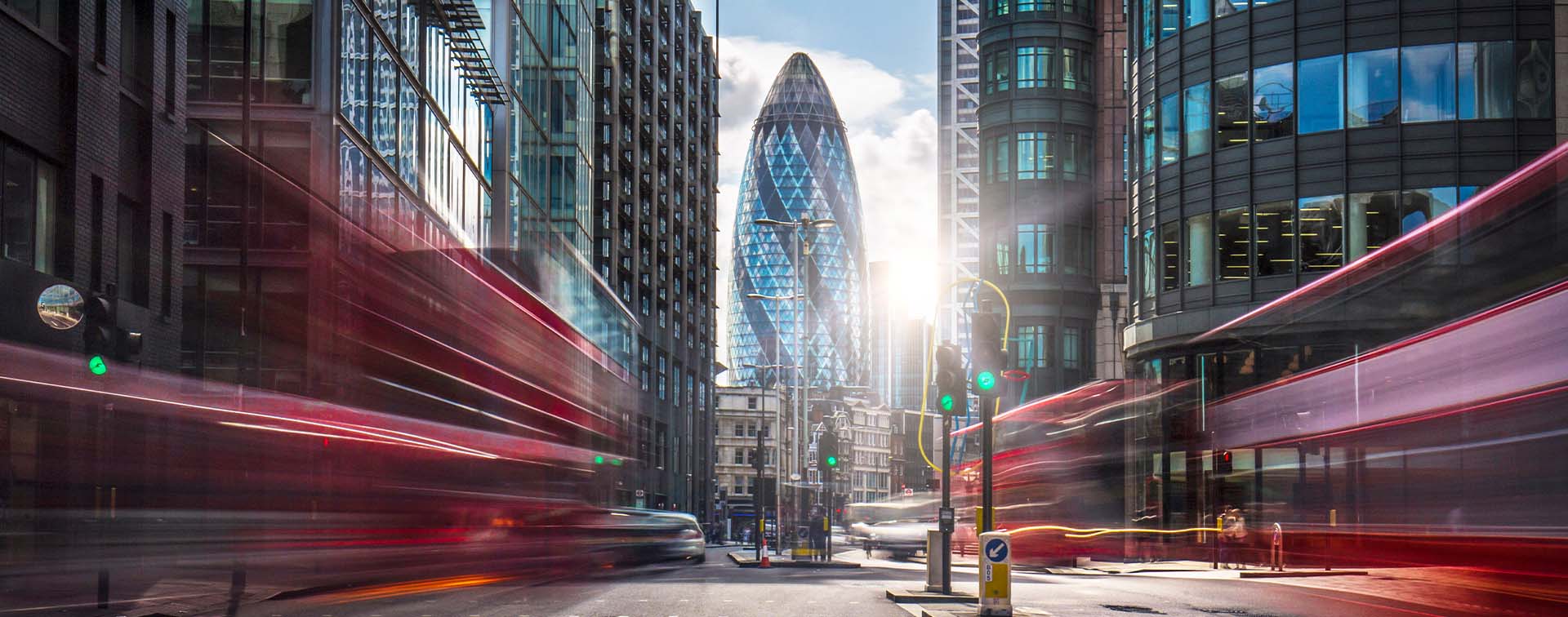 Buses on the street at the financial district of London.