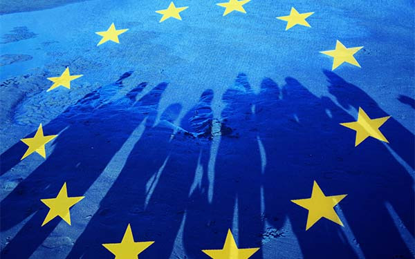 Flag of European Union with silhouette of people